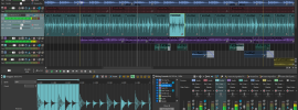 boris-fx-acid-pro0 - Ohjelmistot.fi Multi-track music project in ACID Pro: blue pad/waveform sections on top, red percussion, teal bass and purple synth tracks, with a full mixer panel visible; playback cursor around 01:00.