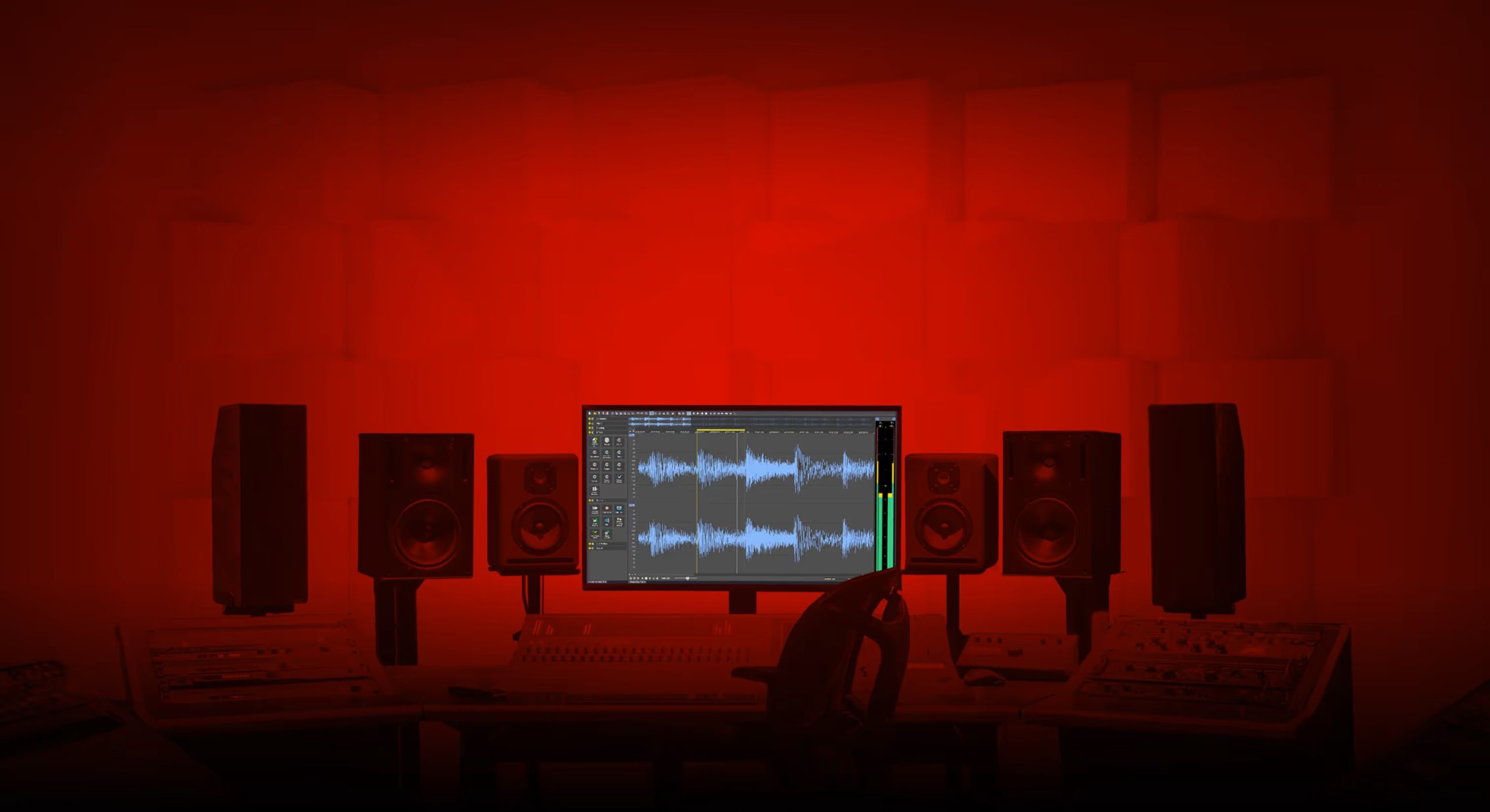 Recording studio workstation with a central monitor showing audio waveforms, flanked by large studio monitors in a red-lit room