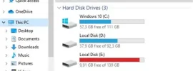 Windows File Explorer showing disk drives and usage bars: C:, D:, E: local disks with free space, and a removable drive F: labeled CCCOMA_X64F indicating 14.1 GB free of 28.8 GB.